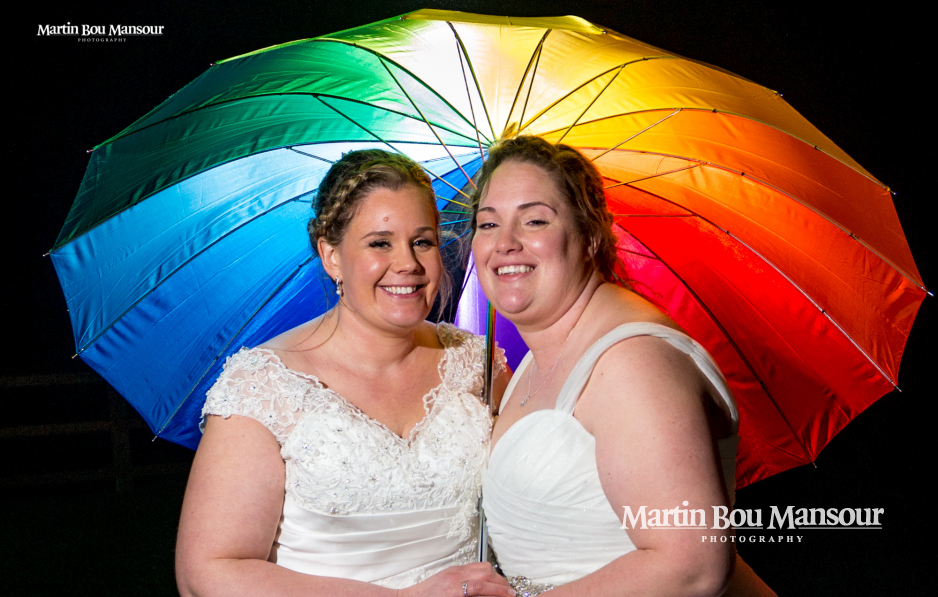 Same sex wedding Everholt Hall Rainbow Umbrella